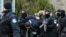 Kosovo police escort Marko Djuric a Serb official to a police station in Kosovo capital Pristina after he was arrested in northern Kosovo town of Mitrovica, Monday, March 26, 2018. 