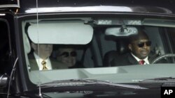 Secretary of State Hillary Clinton, center, is transported on the New York Presbyterian Hospital complex Wednesday, Jan. 2, 2013. 