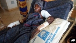 FILE - A man receives treatment at the Jos University teaching hospital in Jos, Nigeria, June 25, 2018, after clashes in central Nigeria between mostly Muslim herders and Christian farmers.