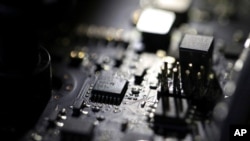 FILE - The inside of a computer is seen in Jersey City, N.J., Feb 23, 2019. A ransomware attack paralyzed the networks of at least 200 U.S. companies July 2, 2021, according to a cybersecurity researcher.