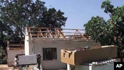 Farmer workers cleaning-up following massive looting on a targeted commercial farm.