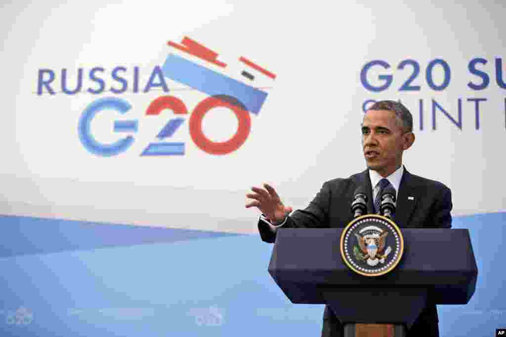 Backdropped by Kobani, in Syria, a Turkish forces armored vehicle patrols the border road in Mursitpinar, on the outskirts of Suruc, on the Turkey-Syria border, Oct. 14, 2014. 