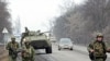 Interior Ministry officers patrol a motorway from the town of Malgobek to Nazran in the Russian southern region of Ingushetia, January 28, 2011.