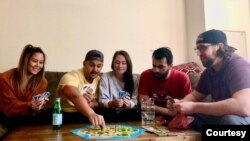 After his first week home, Francis Wilson (2nd from right) could finally join his roommates for the living room games that kept them sane while they were quarantined with coronavirus symptoms and he was in the hospital. (Courtesy - Zack Armstrong)