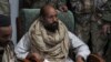 Saif al-Islam Gadhafi in custody of revolutionary fighters shortly after his capture, Obari, Libya, Nov. 19, 2011.