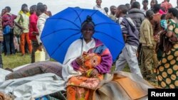 Wakimbizi ambao wanaishi katika kambi ya wakimbizi ya Kiziba huko Wilaya ya Karongi, Rwanda, Februari 21, 2018.