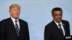 Rais Donald Trump na Mkuu wa Shirika la Afya Duniani (WHO) Tedros Adhanom wakiwa Ujerumani wakati wa mkutano wa G20, 2017.(Photo by SAUL LOEB / AFP)