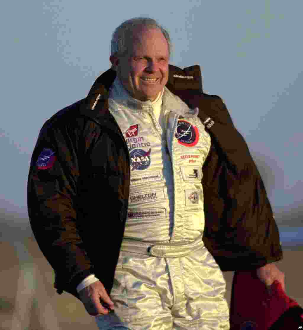 In this file photo, American adventurer Steve Fossett walks across a windy runway to the GlobalFlyer at the Salina Municipal Airport in Salina, Kan. on Feb. 28, 2005. (AP Photo/Charlie Riedel)