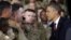 President Barack Obama (R) greets members of the military before speaking at Fort Bliss, Texas, August 31, 2012.