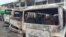 FILE - Burned buses are seen at the bus terminal in Buea, Cameroon, July 10, 2018. Gunfire broke out in the capital of a western region of Cameroon gripped by violence between anglophone separatists and security forces.