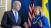 Swedish Prime Minister Fredrik Reinfeldt, left, greets US Secretary of State Hillary Rodham Clintonas she arrives for meetings at Rosenbad in Stockholm, Sweden, Sunday, June 3, 2012.