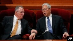 Ulisses Soares, left, of Brazil and Gerrit W. Gong, a Chinese-American, join a panel called the Quorum of the Twelve Apostles during a twice-annual conference of the Church of Jesus Christ of Latter-day Saints Saturday, March 31, 2018, in Salt Lake City.