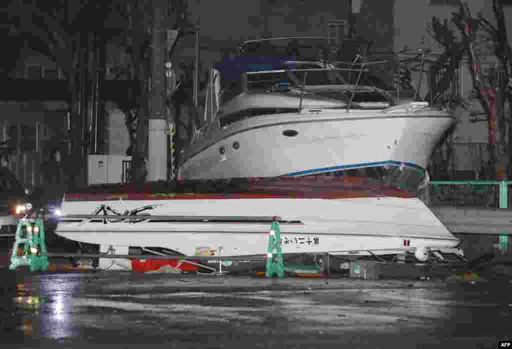 Boats lie on a street after being carried by storm surge caused by typhoon Jebi in Nishinomiya, Hyogo prefecture. The strongest typhoon to hit Japan in 25 years battered the west of the country with violent winds and heavy rain, killing six and injuring scores more. Powerful gusts ripped sheeting from rooftops, overturned trucks on bridges and swept a tanker anchored in Osaka Bay into a bridge to Kansai International Airport.