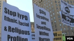 Signs carried by protesters call for end to spying.