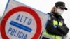 A border officer stands at the last toll gate entering Spain from France, following an order from the Spanish government to set up controls at its borders in response to the coronavirus, in La Jonquera, Spain, March 17, 2020. 