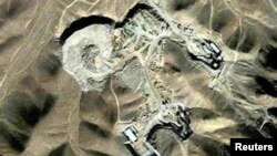 A Syrian man reacts following a reported air strike by government forces in the rebel-held neighborhood of Bustan al-Qasr.