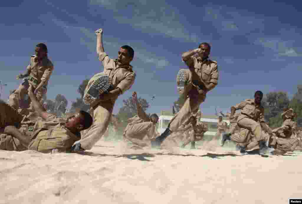 Newly recruited members of the Yemeni military police force participate in exercises at their barracks in Sana&#39;a.