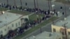 A line of people in Los Angeles waiting for free food for the Thanksgiving holiday