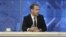 Russian Prime Minister Dmitry Medvedev (C) talks during an interview broadcast on state television in Moscow, Russia, Dec. 9, 2015.
