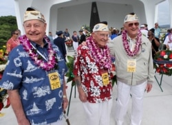 FILE - From left, USS Arizona survivor Lou Conter and Pearl Harbor survivors John Hughes and Edwin Schuler laugh after a wreath presentation aboard the USS Arizona memorial during ceremonies commemorating the 74th anniversary of the attack on Pearl Harbor.