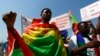 FILE - Ethiopian migrants, all members of the Oromo community of Ethiopia living in Malta, protest against the Ethiopian regime.