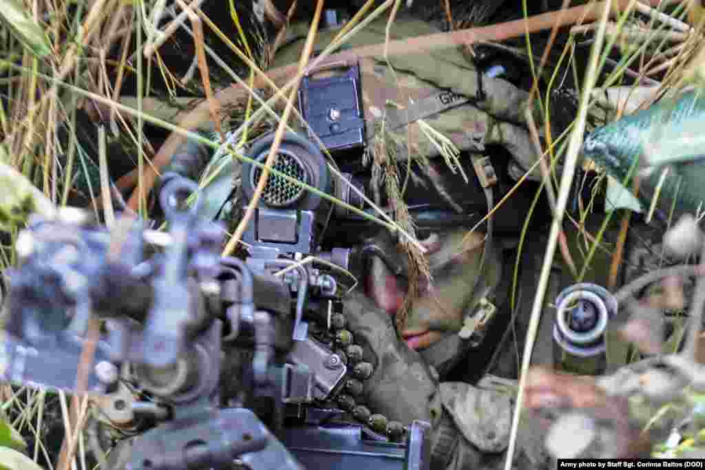 Army Pfc. Benjamin Grasso scans his sectors of fire during Strong Shield, an exercise in Panevezys, Lithuania.
