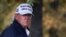 President Donald Trump, in center cart, participates in a round of golf at the Trump National Golf Course, Nov. 7, 2020, in Sterling, Va.