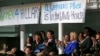 Women attending a Women for Hillary event react as Democratic presidential candidate Hillary Clinton speaks at at the New York Hilton hotel in midtown Manhattan one day ahead of the New York primary, April 18, 2016. 