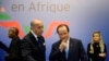 FILE - French President Francois Hollande (R) and Foreign Minister Laurent Fabius attend the opening session of the Elysee Summit for Peace and Security in Africa at the Elysee Palace, in Paris, Dec. 6, 2013.