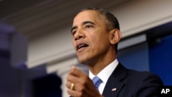 2013年9月30日，奥巴马总统在白宫发表讲话谈论预算争议时的照片。
