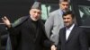 Afghan President Hamid Karzai (L) welcomes his Iranian counterpart Mahmoud Ahmadinejad upon his arrival in Kabul, March 10, 2010. 