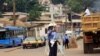 FILE - A police officer directs traffic in Yaounde, Cameroon.