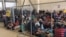 FILE - An overcrowded fenced area holding families at a Border Patrol station is seen in a still image from video in McAllen, Texas, June 10, 2019.